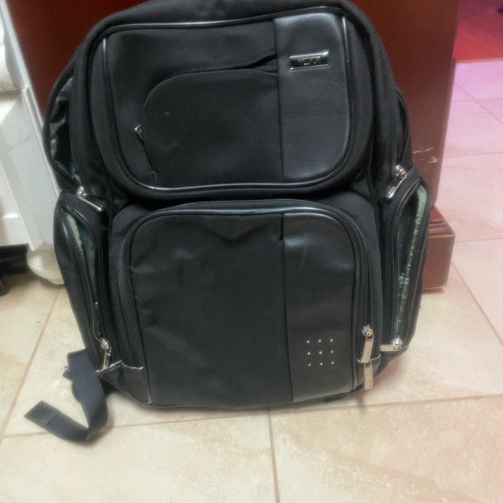 Tumi Black Backpack with Silver Accents